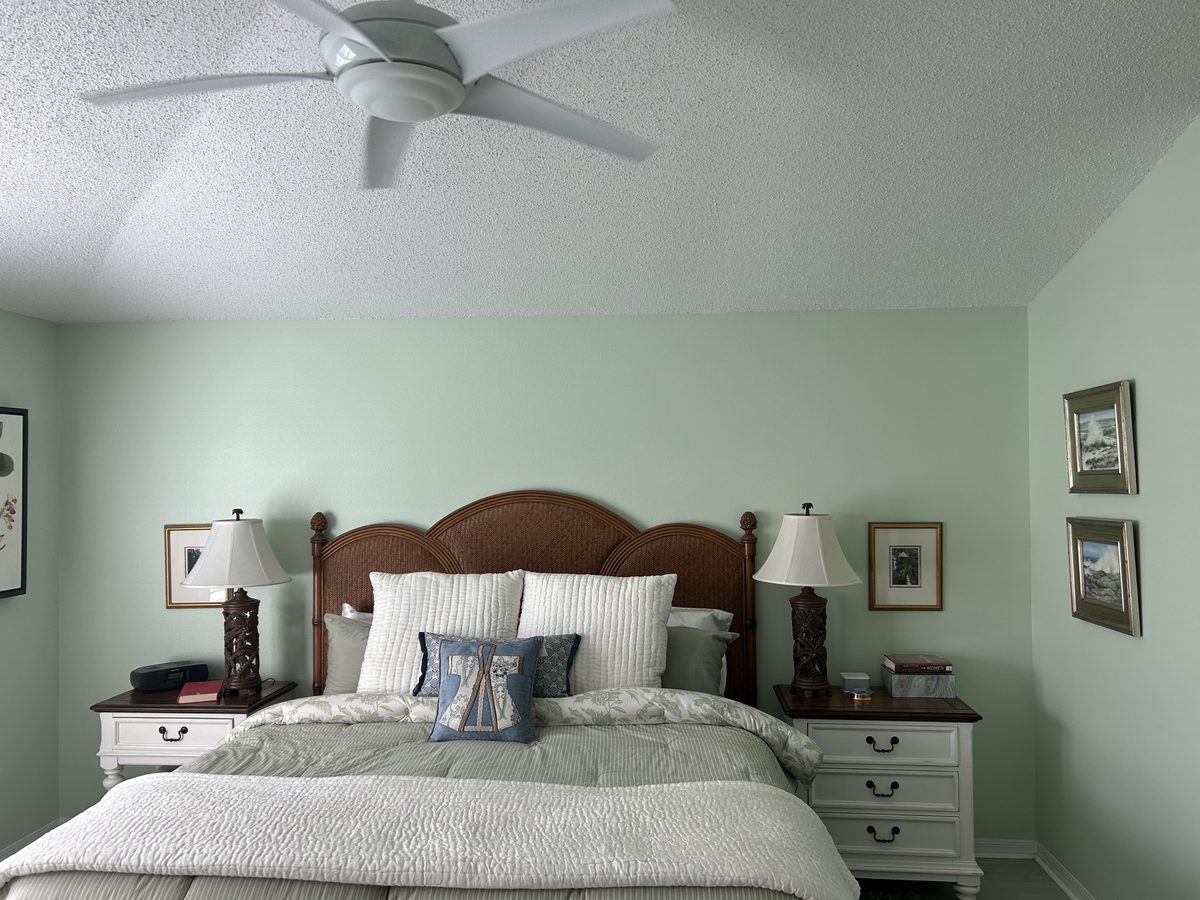 Bedroom before refresh with painted green walls