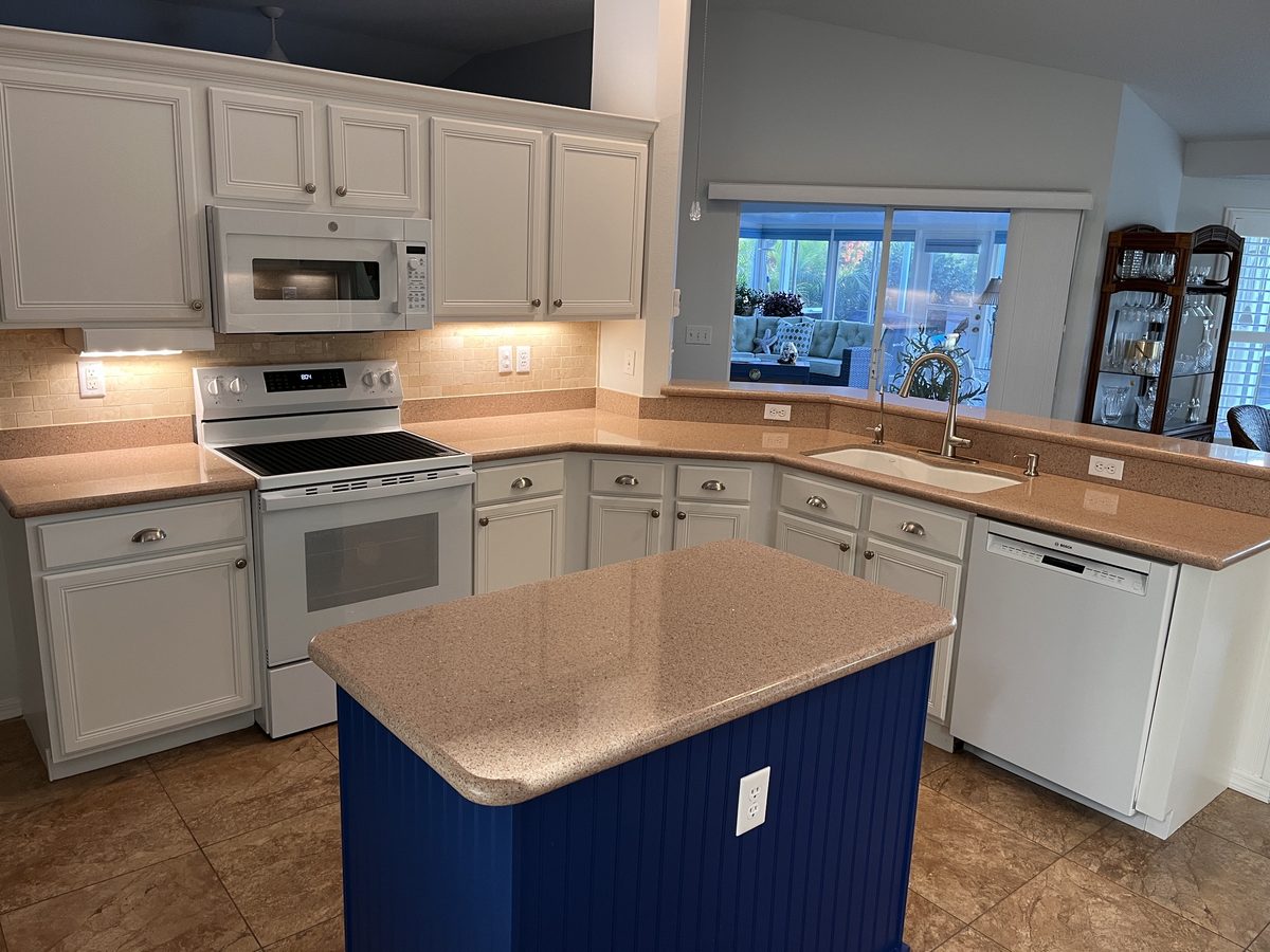 Kitchen before remodel with original cabinets and countertops