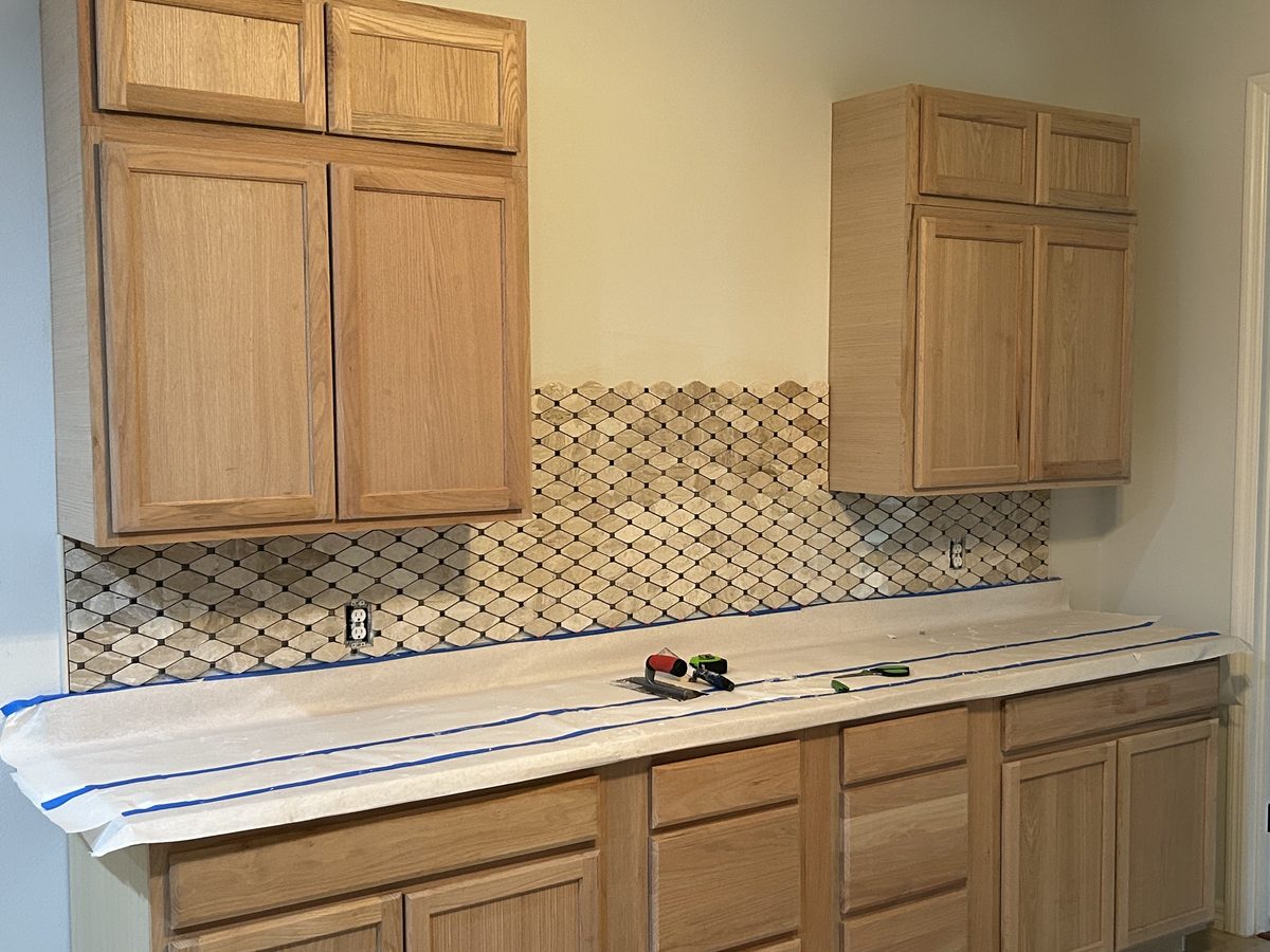 Kitchen mid-remodel with cabinets removed