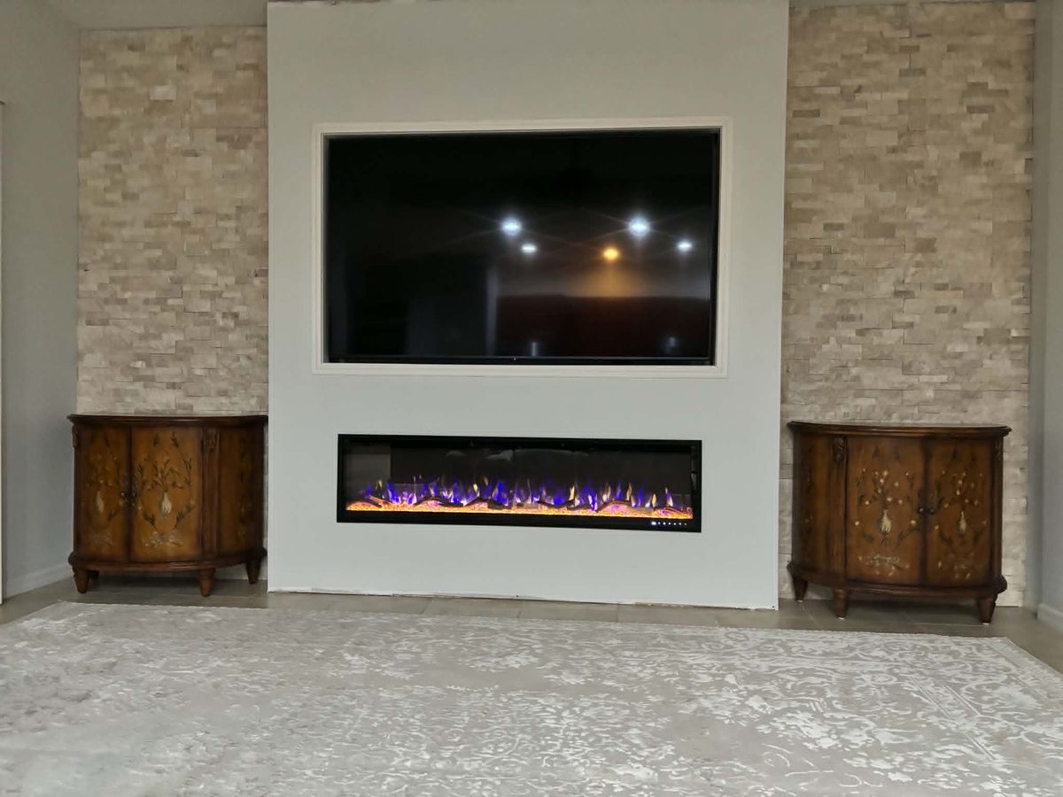 Living room after with custom built-in electric fireplace and stone accent wall
