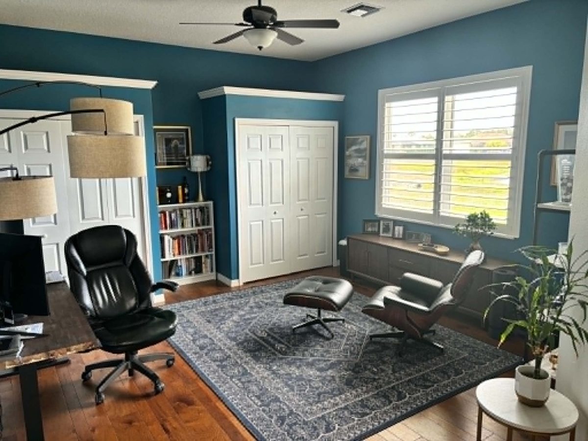 Home office after conversion with accent wall paint and furnishing